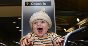 Read more about the article 9 Tips For Air Travel With A Baby Without (Too Many ) Tears