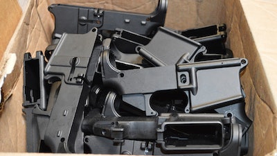 This photo provided by the U.S. Department of Justice shows AR-15 lower receivers, which federal agents have seized, including these unfinished ones taken in 2014 in California, for firearms investigations nationwide. For decades, the federal government has treated the mechanism called the lower receiver as the essential piece of the semiautomatic rifle, which has been used in some of the nation's deadliest mass shootings. But some defense attorneys have recently argued that the part alone does not meet the definition in the law.