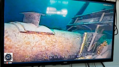 This June 2020 file photo, shot from a television screen provided by the Michigan Department of Environment, Great Lakes, and Energy shows damage to anchor support EP-17-1 on the east leg of the Enbridge Line 5 pipeline within the Straits of Mackinac in Michigan. Michigan Gov. Gretchen Whitmer criticized Enbridge Inc. on Wednesday, July 22, 2020 for what she described as the company's refusal to make an airtight pledge that it would pay for any damages caused by an oil spill from its pipeline beneath a Great Lakes waterway.