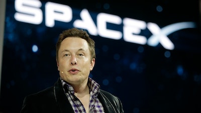 In this May 29, 2014, file photo, Elon Musk, CEO and CTO of SpaceX, introduces the SpaceX Dragon V2 spaceship at the SpaceX headquarters in Hawthorne, Calif.