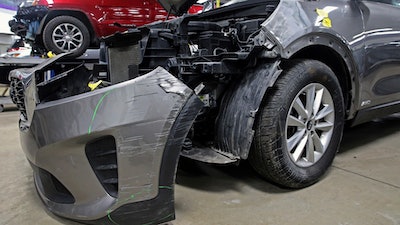 A Kia which was damaged after being stolen is seen at an auto repair shop in Milwaukee on Wednesday, Jan. 27, 2021.