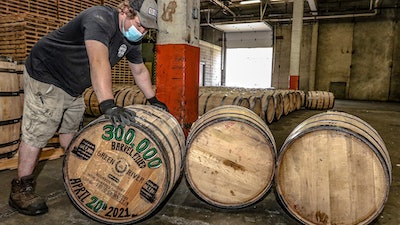 Green River Distilling Co. employee Coleman Savage looks over the 300,000th barrel of bourbon filled at the distillery inside the new-fill warehouse at the plant on April 20, 2021, in Owensboro, Ky.