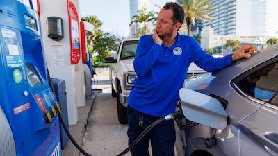 A driver puts fuel in his vehicle in Sunny Isles Beach, Fla., April 18, 2023.
