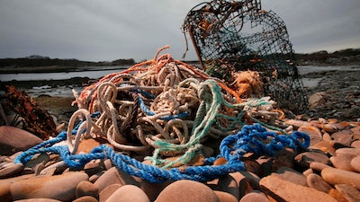 A washed-up lobster trap and tangled lines on a beach in Biddeford, Maine, Nov. 13, 2009.