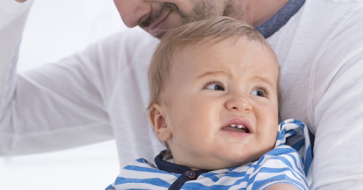 baby screams when dad holds him