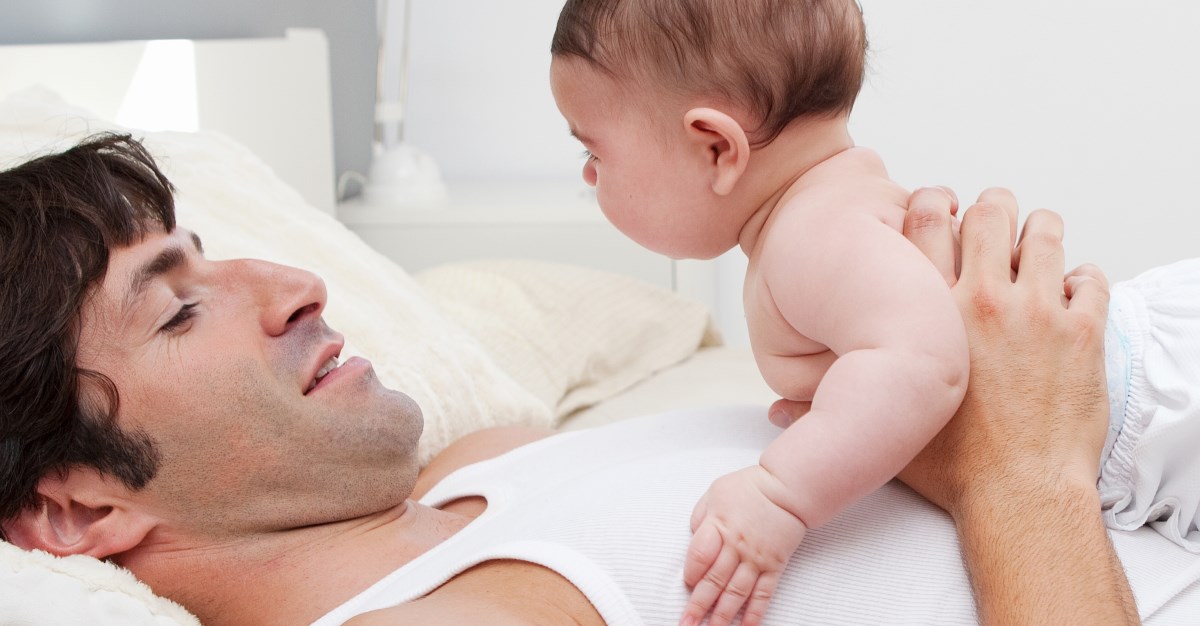 dad play with newborn