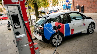 In this Wednesday, Oct. 18, 2017 photo a car is connected to a charging station for electric vehicles in Hamburg, Germany. Major automakers say their joint European electric car recharging network will open its first stations this year in Germany, Austria and Norway in what the companies hope will be a big step toward mass acceptance of battery-powered cars.