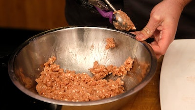 J. Michael Melton, head of culinary for Impossible Foods, the California plant-based meat company, prepares some Impossible Pork dishes as the company unveils Impossible Pork and Impossible Sausage before the CES tech show Monday, Jan. 6, 2020, in Las Vegas.