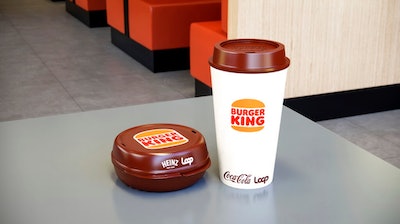 This photos provided by North America Public Relations shows a reusable packaging at a Burger King restaurant. Reusable packaging is about to become more common at groceries and restaurants worldwide. Loop, which collects and sanitizes reusable containers, said Wednesday, Sept. 22, 2021 it’s expanding after successful trials in France and Japan. Kroger and Walgreens in the U.S., and Tesco in the United Kingdom are among the groceries partnering with Loop. McDonald’s, Burger King and Tim Hortons have also signed on.