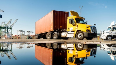 A truck departs from a Port of Oakland shipping terminal on Nov. 10, 2021, in Oakland, Calif.